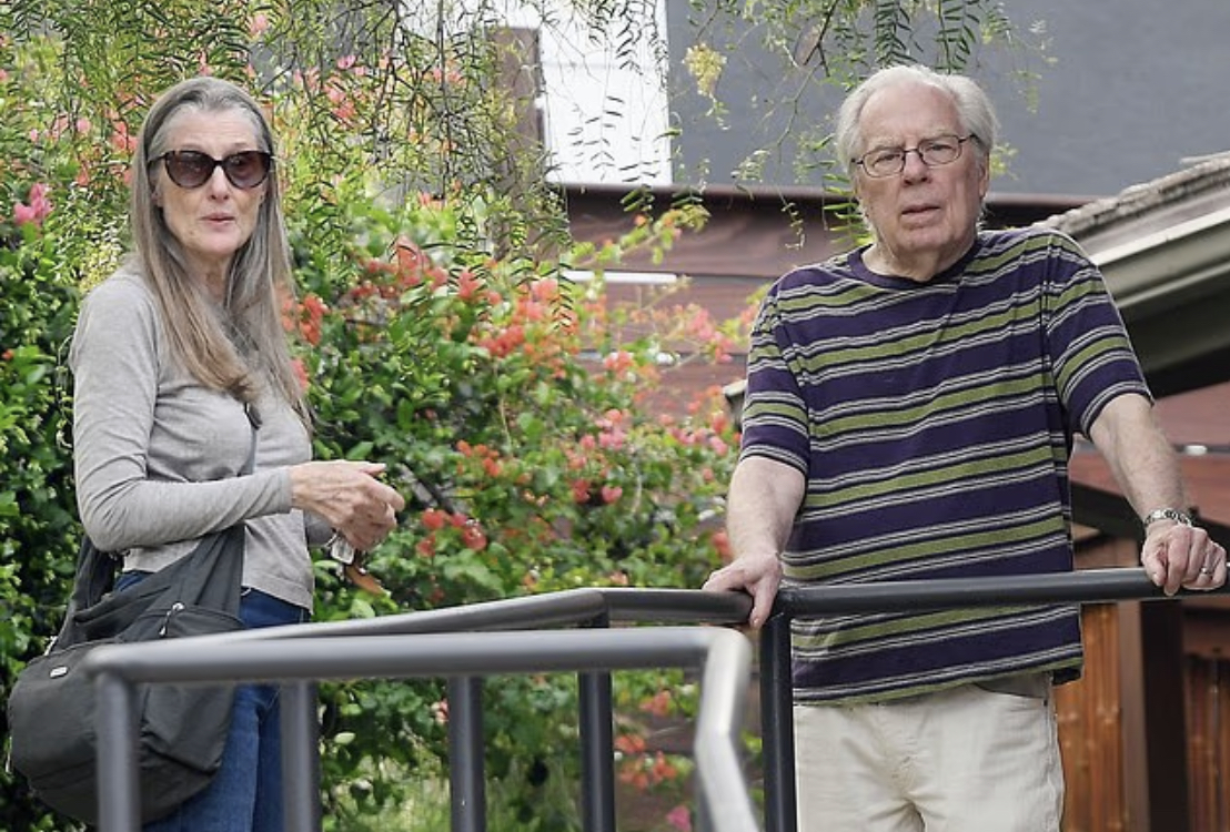 70s sitcom star and SNL icon kisses his Netflix star wife of 26 years during rare outing